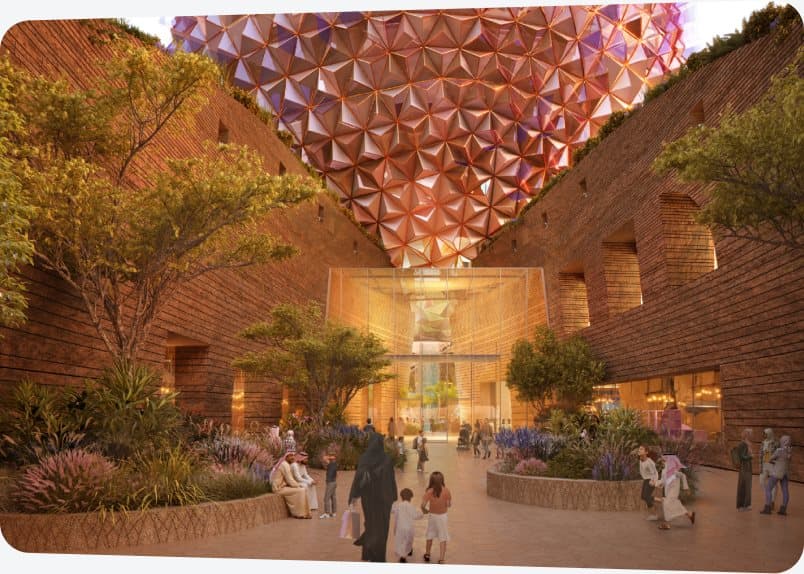 Visitors in the ilmi center courtyard beneath the dome canopy